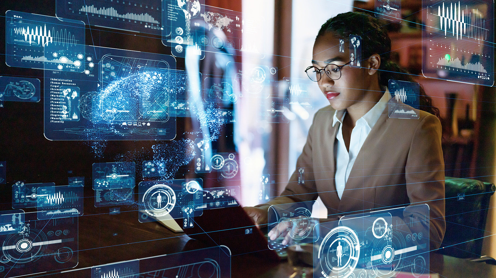 woman at computer with tech graphics