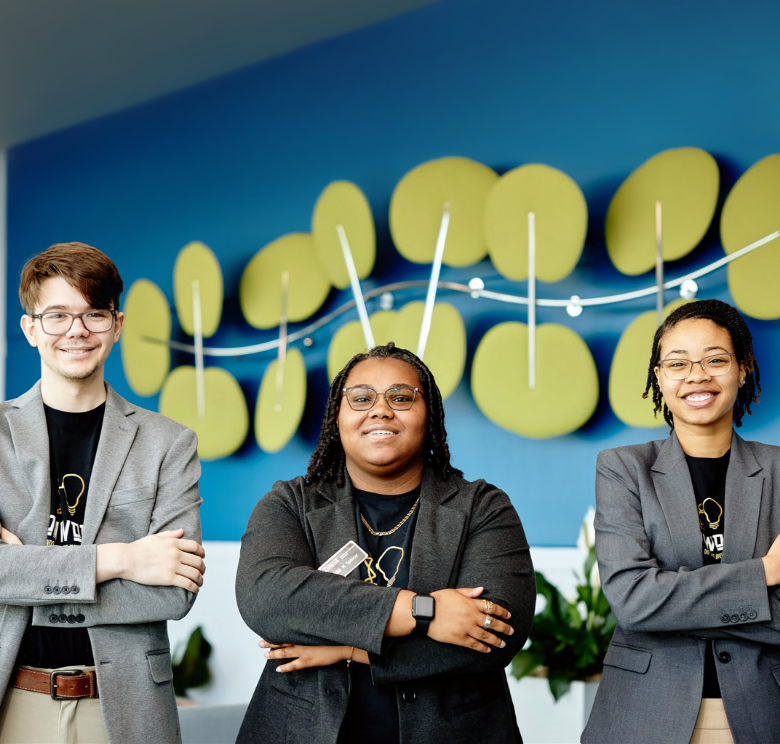 IRONWORKS - THREE YOUNG ENTREPRENEURS STANDING WITH THEIR ARMS CROSSED